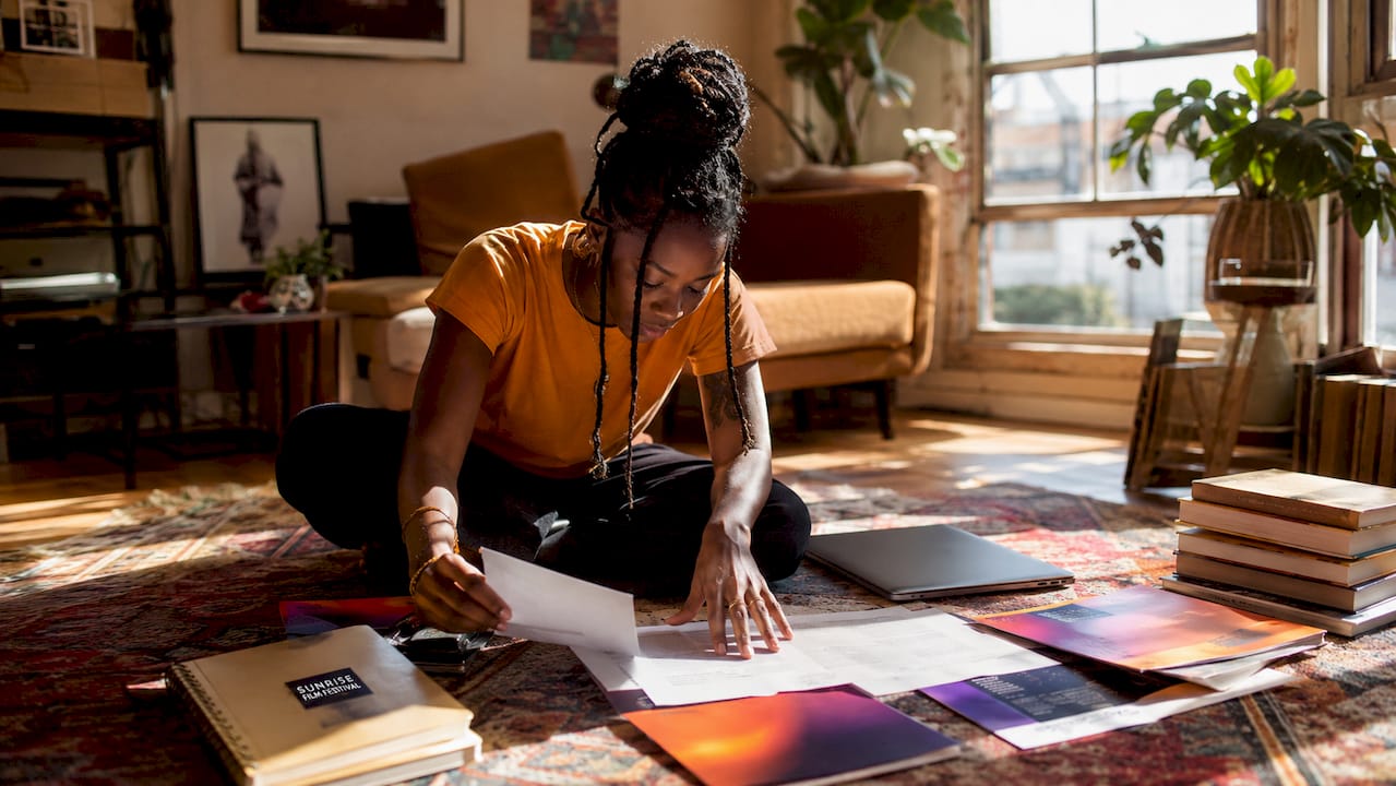 Filmmaker reviewing award-winning short film scripts